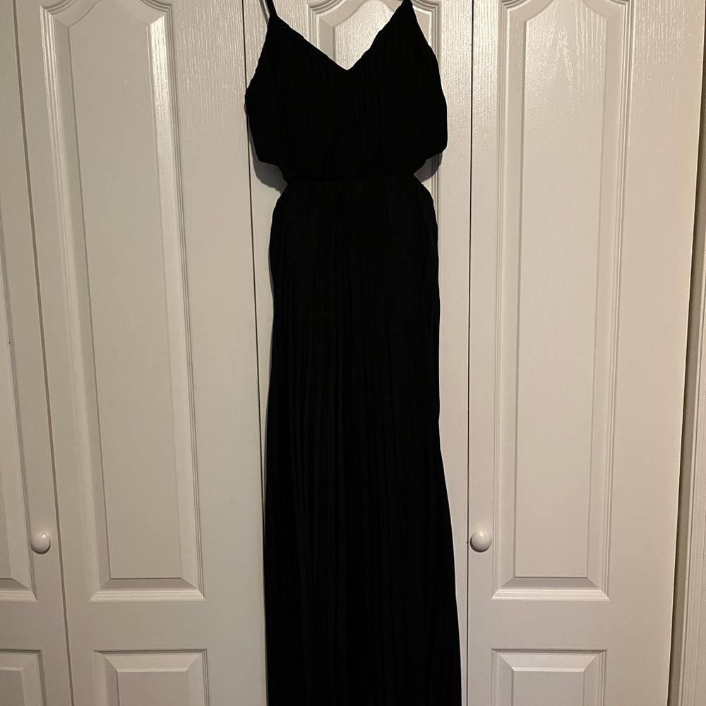 Black maxi dress with cut out sides and pleats